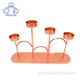 China Rose Gold Metal 4 Arm Candlestick Holder Set Supplier